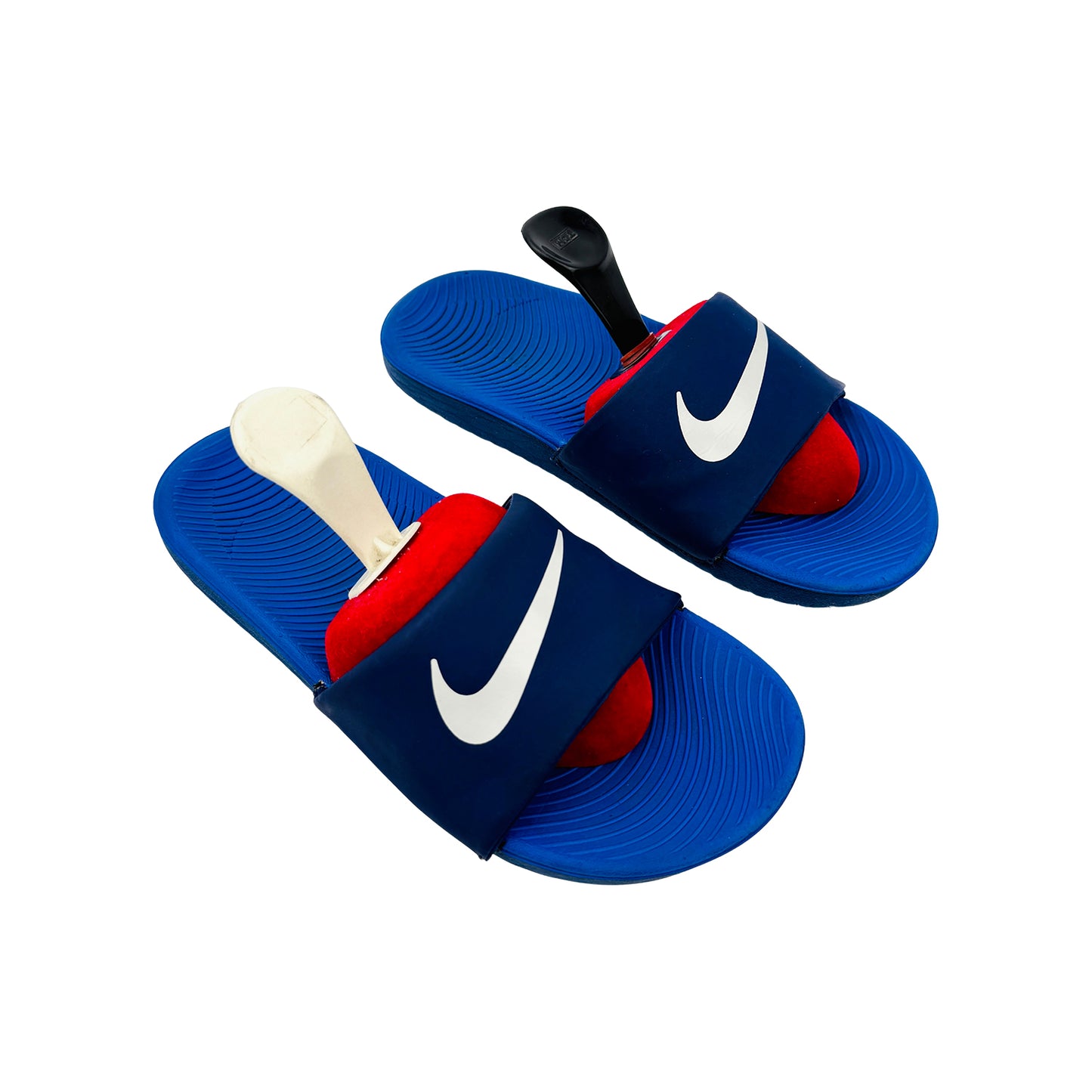Blue Nike kawa slides on a white background