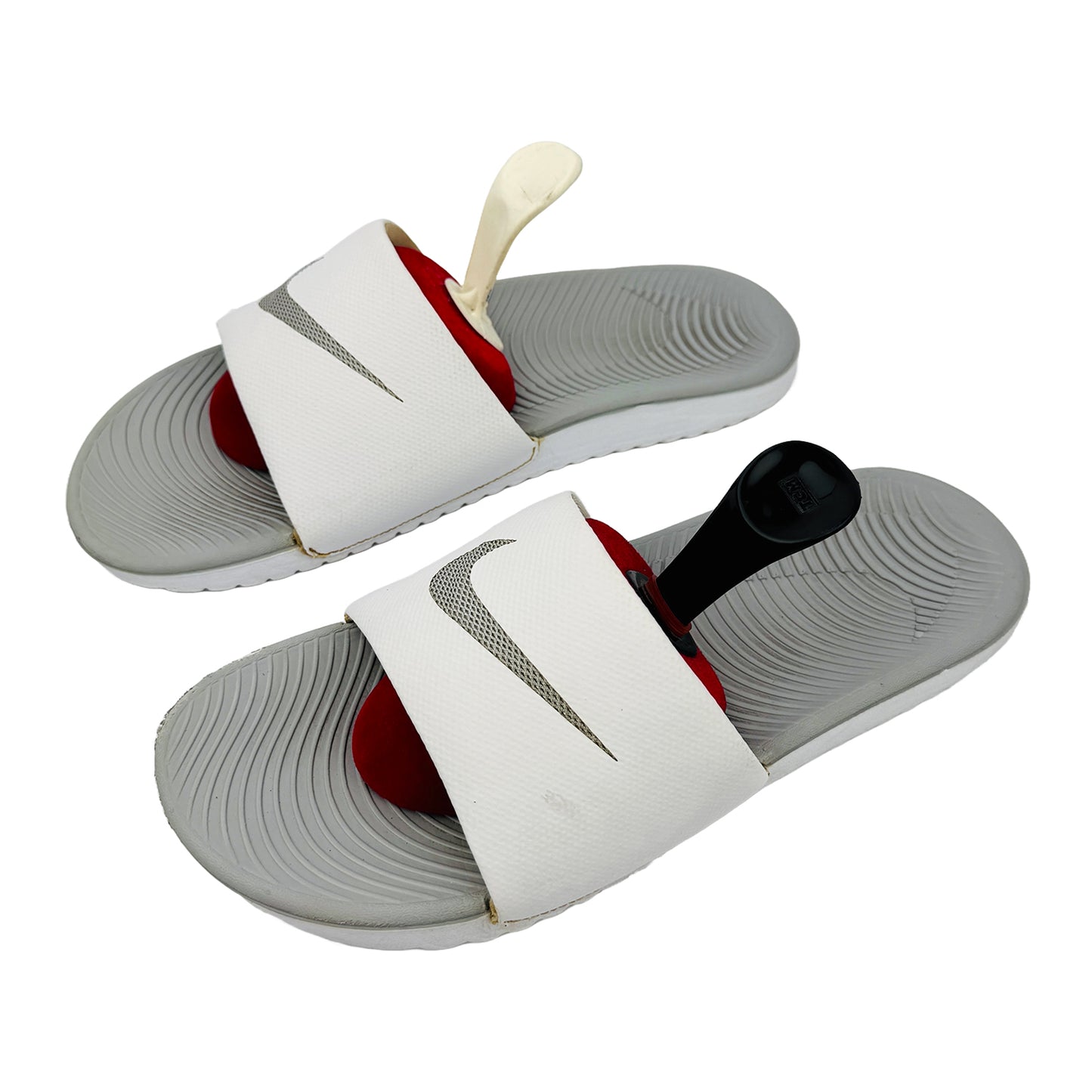 Pair of kawa slides with white straps on a white background