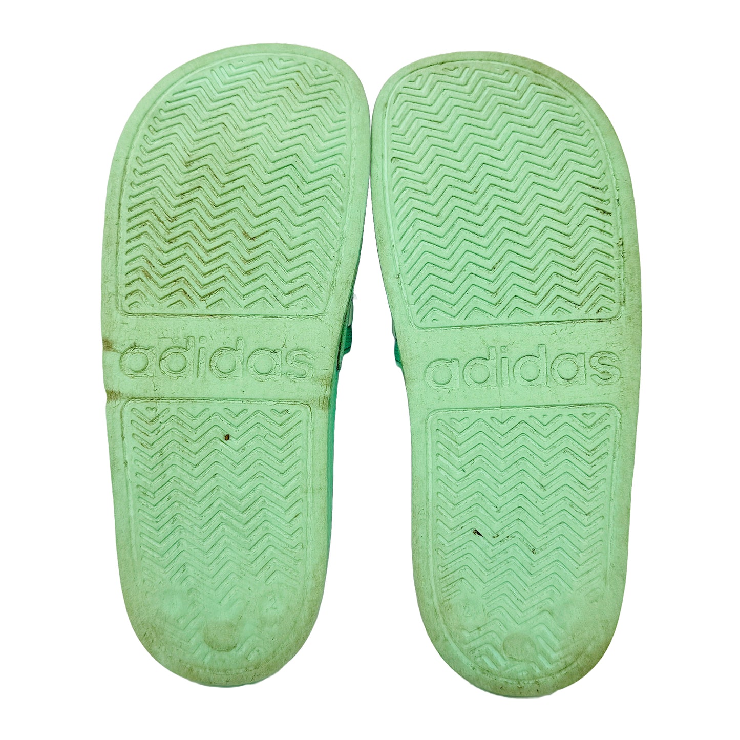 Adidas Adilette Shower Green slides with textured Outsole on a white background