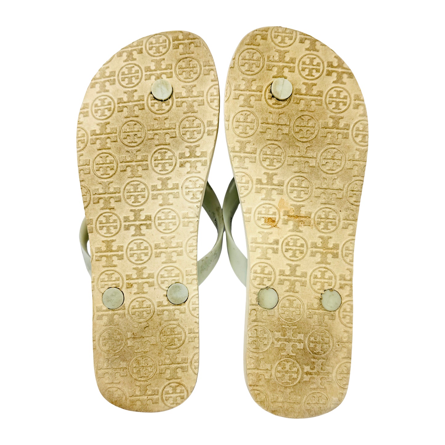 Pair of Tory Burch flip-flops with a brand logo on the outsole with a white background
