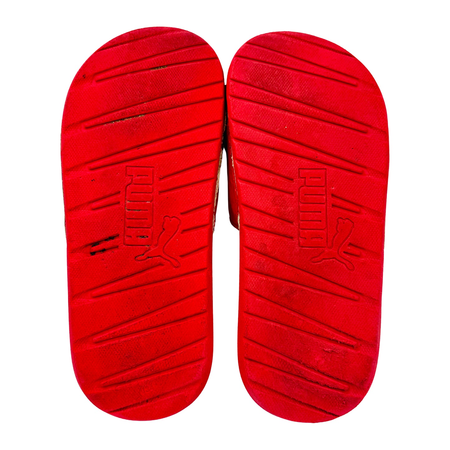 Puma Cool Cat 1.0 slides with a brand logo on the outsole against a white background