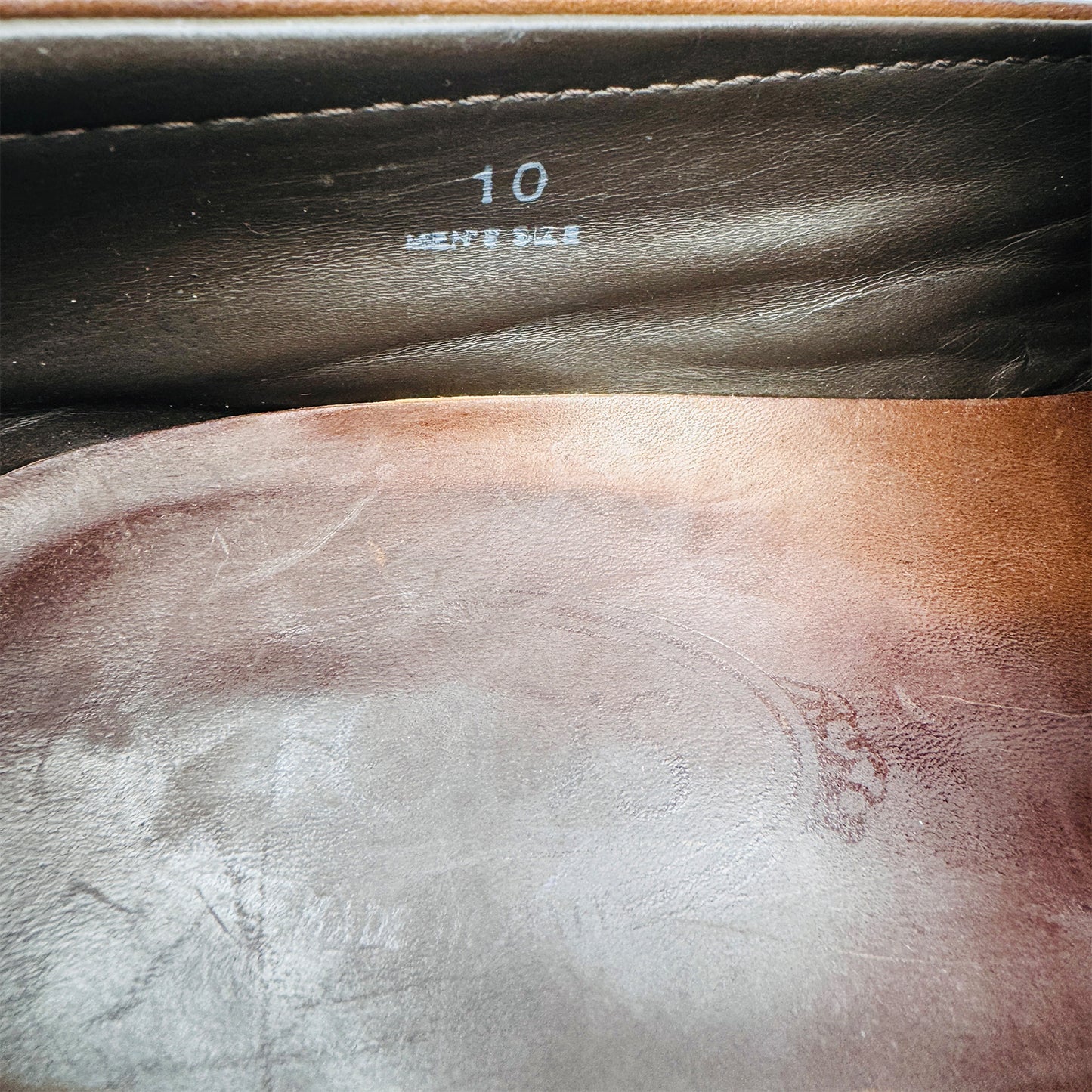 Inside size and logo printing image of Tod's Men's Brown Leather Loafers (Size 44/44.5)
