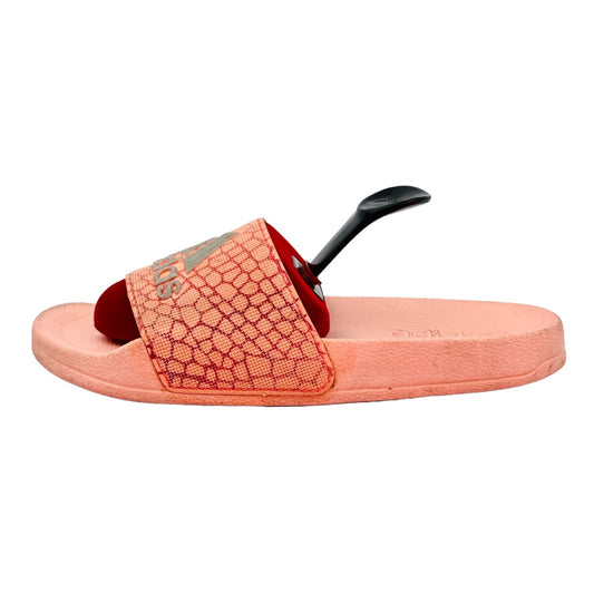 Adidas Adilette slide with a pink strap on a white background