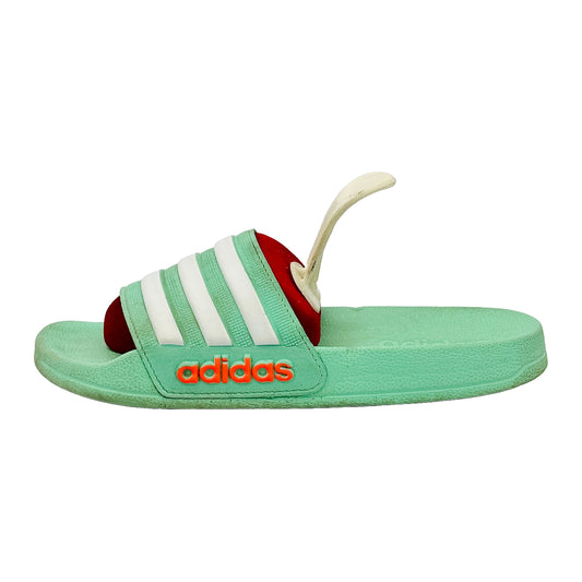 Adidas Adilette Shower Slippers in green color with white stripes on a white background