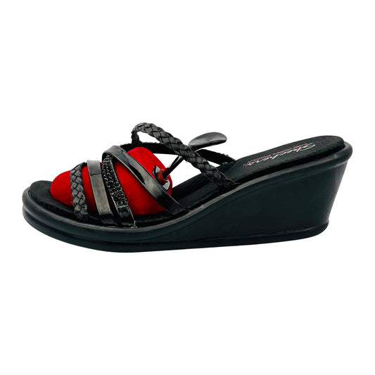 Black wedge Skechers sandal with red sole on a white background