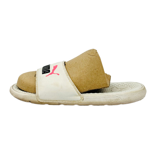 Puma white slides with a logo on a white background